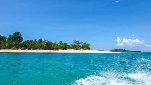Scenic view of sea against blue sky
