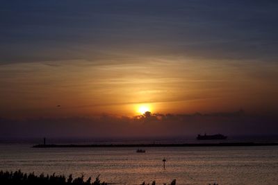 Scenic view of sea at sunset