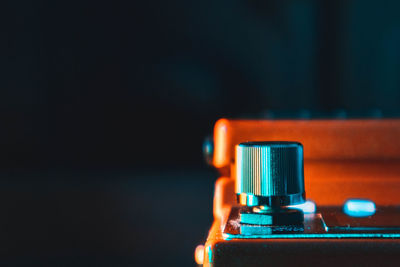 Close-up of electric lamp against black background