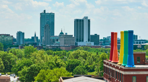 Buildings in city against sky