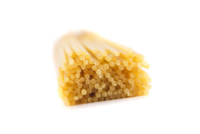 Close-up of yellow cake against white background