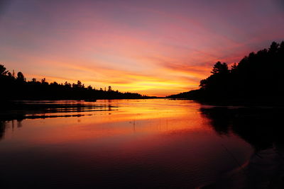 Scenic view of sunset over river