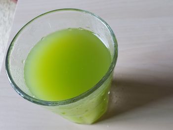 Close-up of lemon on glass table