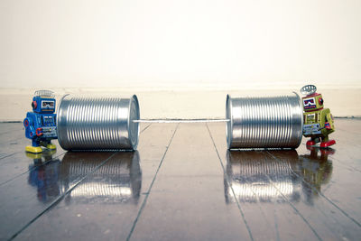 Metallic structure on table against wall