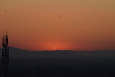 Scenic view of silhouette landscape against romantic sky at sunset