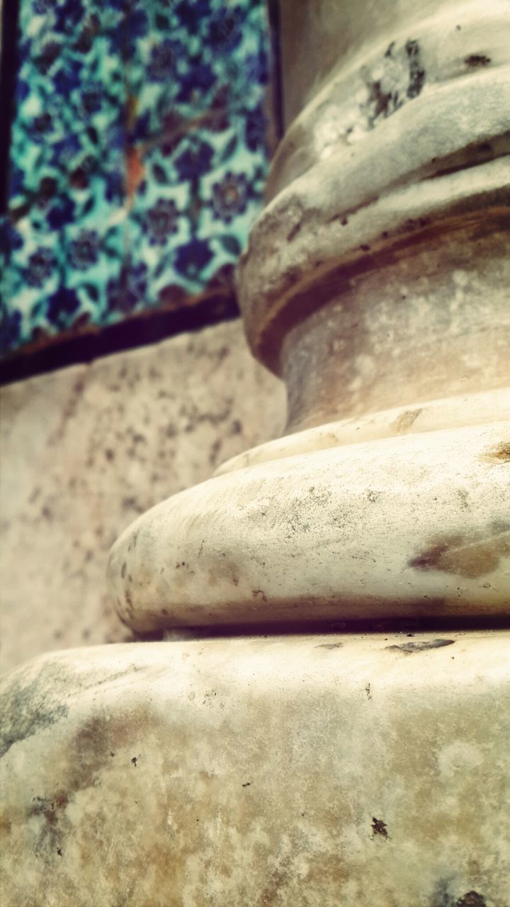 close-up, focus on foreground, stone material, old, sculpture, art and craft, built structure, art, statue, no people, day, human representation, history, outdoors, wall - building feature, stone - object, religion, stone, carving - craft product, weathered