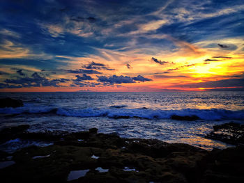 Scenic view of sea against dramatic sky