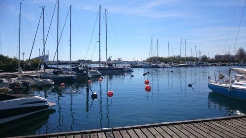 Boats moored at harbor