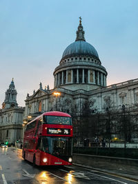 Bus on street by st paul cathedral at dusk