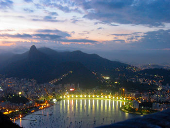 View of cityscape against cloudy sky
