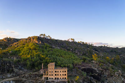 Drone aerial panorama of termas radium hotel serra da pena at sunset in sortelha, portugal