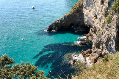 High angle view of rock formation in sea