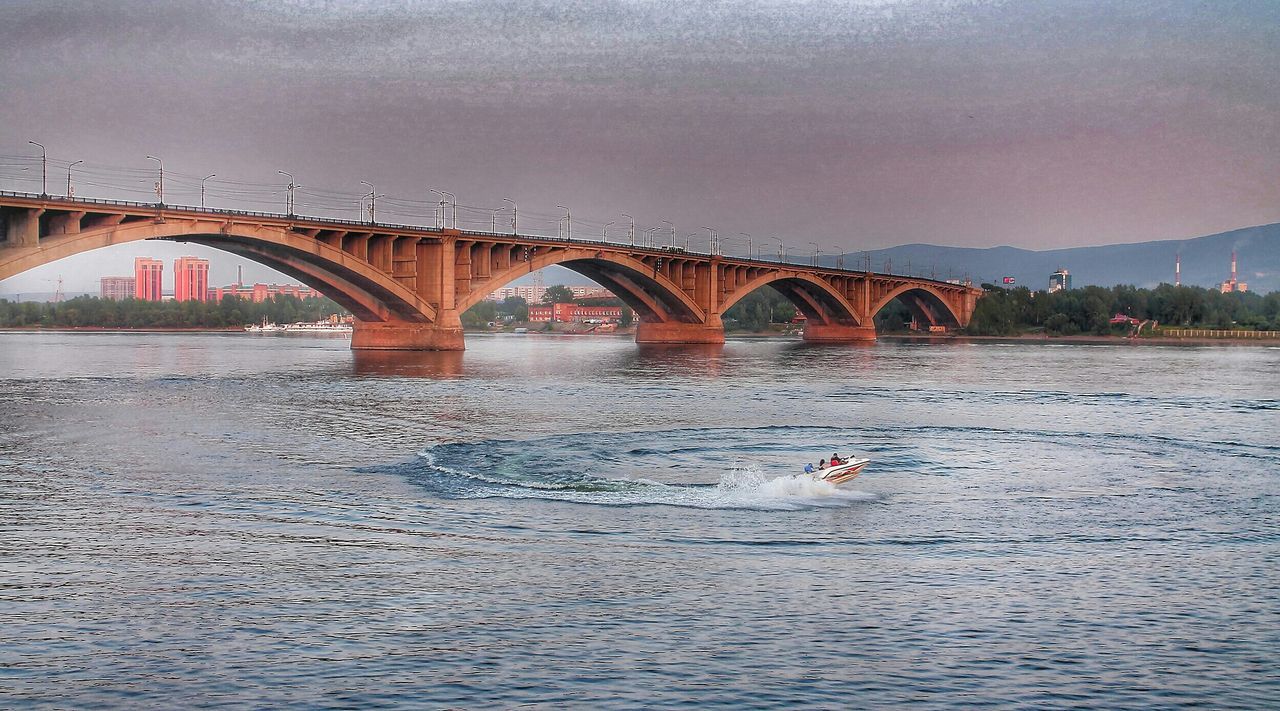 water, connection, bridge - man made structure, built structure, architecture, waterfront, river, transportation, bridge, engineering, sky, rippled, suspension bridge, outdoors, arch bridge, building exterior, animal themes, travel destinations, nature, arch