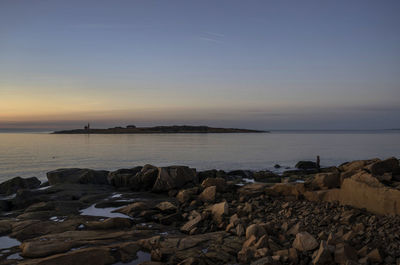 Scenic view of sea against sky at sunset