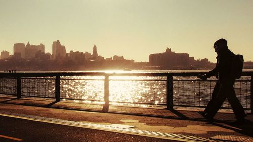 River in city at sunset