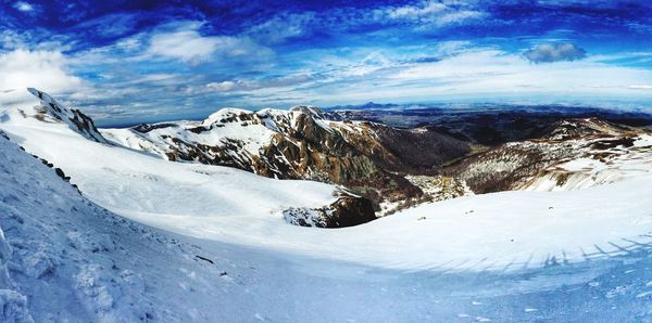 Scenic view of snow covered mountains