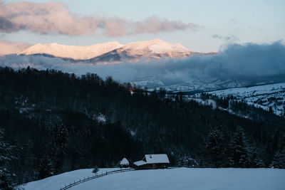 Scenic view of snowcapped mountains against sky