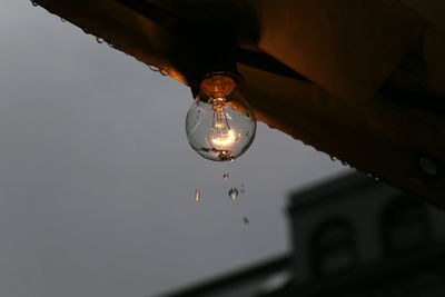 Low angle view of illuminated light bulb