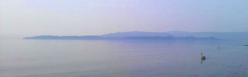 Scenic view of lake with mountains in background