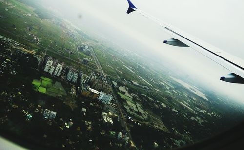 Cropped image of airplane over landscape