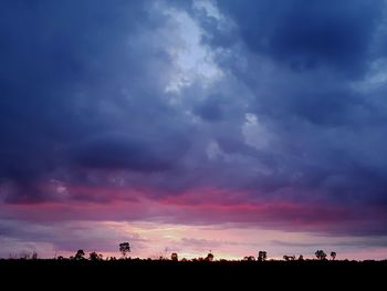 Silhouette landscape against sky during sunset