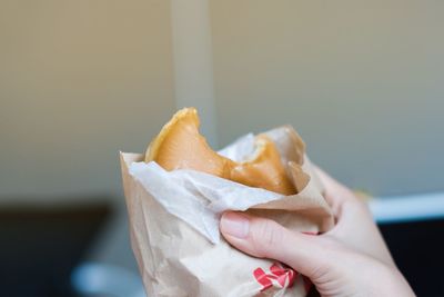 Close-up of hand holding ice cream