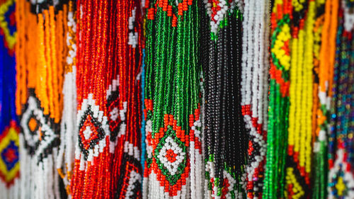 Full frame shot of multi colored decorations hanging at market