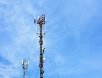 Low angle view of communications tower against sky