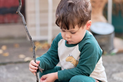 Cute little boy playing in the backyard