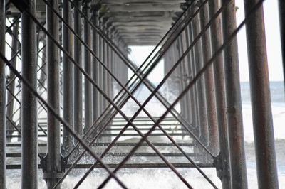 Close-up of metal structure against sky