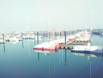 Boats moored at harbor