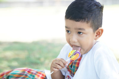 Portrait of cute boy on field