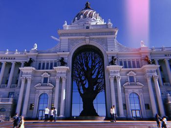 Low angle view of building against blue sky