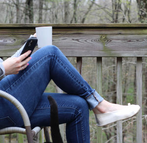 Man using mobile phone while sitting on seat