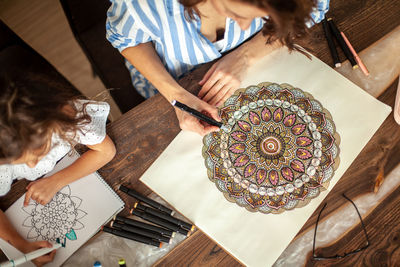 High angle view of people on table