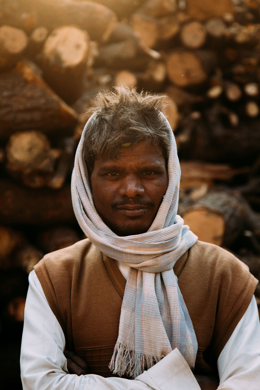 Varanasi, india - february, 2018: close-up portrait of serious hindu male in turban looking at camera