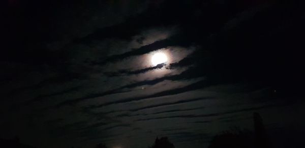 Low angle view of moon in sky at night