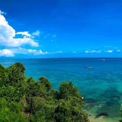 Scenic view of sea against blue sky