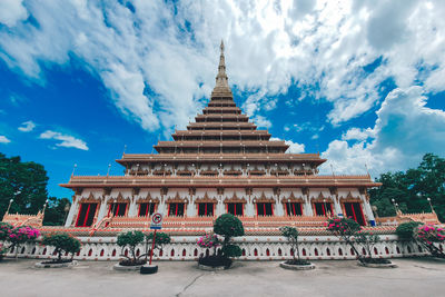 View of temple building against cloudy sky