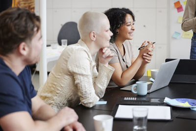 Group of business people attending business meeting in office