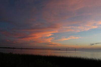 Reflection of clouds in lake at sunset