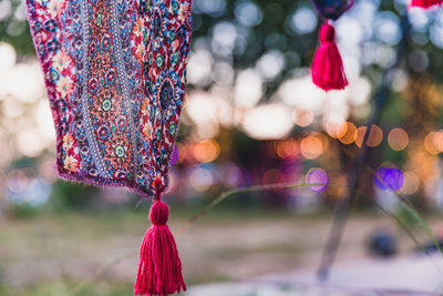 Close-up of multi colored decorations hanging on tree