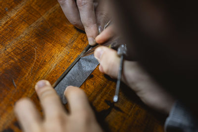 Cropped hands of man playing guitar