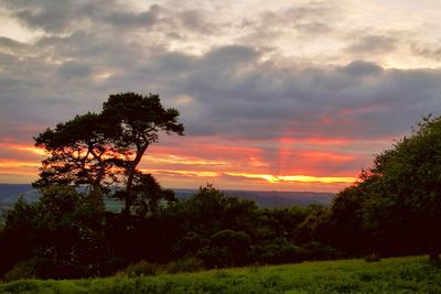 Scenic view of landscape against cloudy sky