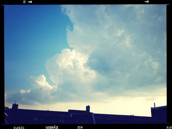 High section of building against cloudy sky