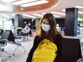 Portrait of woman sitting in bus