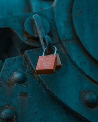 Close-up of padlocks hanging on metal