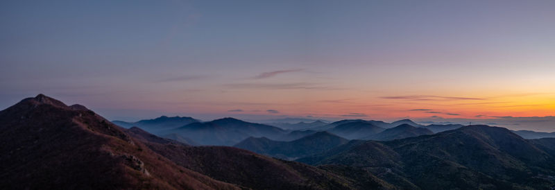 Scenic view of mountains against sky during sunset