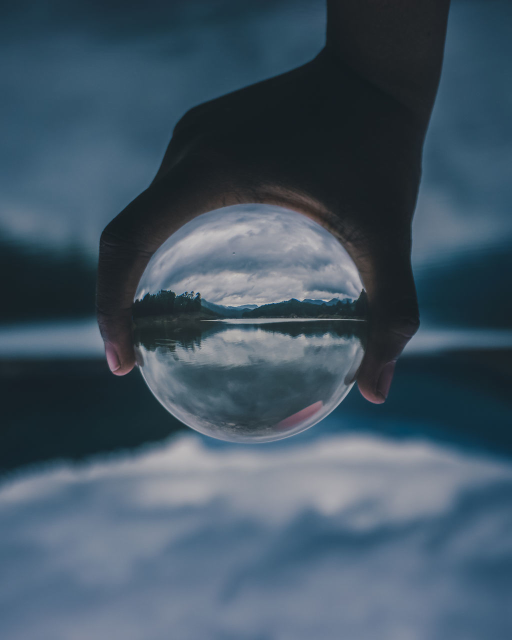 REFLECTION OF PERSON HAND ON GLASS