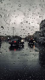 Full frame shot of wet glass window in rainy season